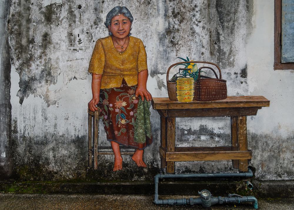 Colourful murals along Phang Nga Road in Phuket Old Town, a district where newcomers often compare neighbourhoods